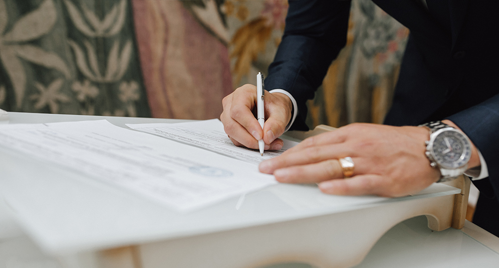 Person writing in an MOA document